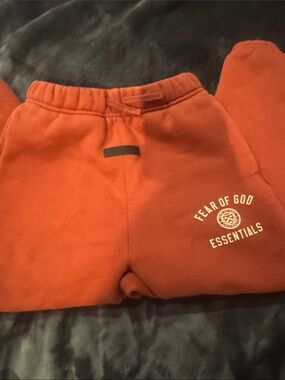 Fear of God Kids Orange Rust Sweat Joggers with Essentials Print